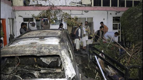 In this August 29, 2021 photo, Afghans inspect damage of Ahmadi family house after a US drone strike in Kabul, Afghanistan. The Pentagon retreated from its defence of a drone strike that killed multiple civilians in Afghanistan last month, announcing on Friday, that a review revealed that only civilians were killed in the attack, not an Islamic State extremist as first believed. (AP) In this August 29, 2021 photo, Afghans inspect damage of Ahmadi family house after a US drone strike in Kabul, Afghanistan. The Pentagon retreated from its defence of a drone strike that killed multiple civilians in Afghanistan last month, announcing on Friday, that a review revealed that only civilians were killed in the attack, not an Islamic State extremist as first believed. (AP)