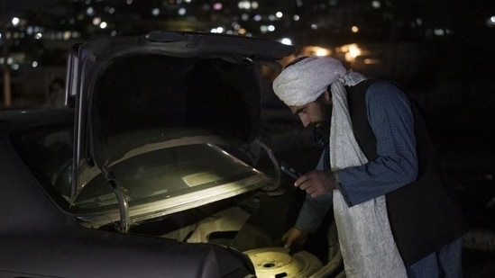 A Taliban fighter checks the trunk of a car at a checkpoint in Kabul, Afghanistan. (AP file photo) A Taliban fighter checks the trunk of a car at a checkpoint in Kabul, Afghanistan. (AP file photo)