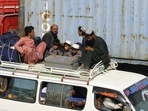 Men and children from Afghanistan sit atop a van with their belongings after crossing into Pakistan at the Friendship Gate crossing point at the Pakistan-Afghanistan border town of Chaman, Pakistan.