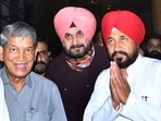 Former Uttarakhand CM and senior Congress leader Harish Rawat, PPCC President Navjot Singh Sidhu and Punjab chief minister Charanjit Singh Channi at Sector 35, in Chandigarh, on Sunday. (Photo by Keshav Singh /Hindustan Times)
