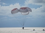 The quartet of newly minted citizen astronauts comprising the SpaceX Inspiration4 mission safely splashes down in SpaceX's Crew Dragon capsule off the coast of Kennedy Space Center, Florida, USA