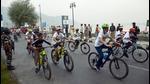 People participating in a cycle race organised by the J&K Police in Srinagar on Sunday. (ANI) People participating in a cycle race organised by the J&K Police in Srinagar on Sunday. (ANI)