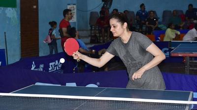 A player in action during the district table tennis championship at Shastri Badminton Hall in Ludhiana on Sunday. (Harsimar Pal Singh/HT)