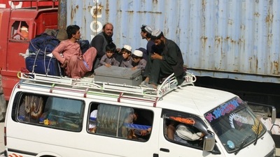 Men and children from Afghanistan sit atop a van with their belongings after crossing into Pakistan at the Friendship Gate crossing point at the Pakistan-Afghanistan border town of Chaman, Pakistan. (REUTERS)
