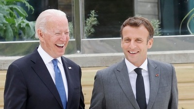 Emmanuel Macron (right) and Joe Biden at G7 summit in June (AFP)