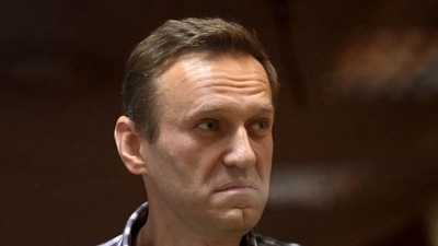 In this file photo taken on February 20, 2021, Russian opposition leader Alexei Navalny stands inside a glass cell during a court hearing at the Babushkinsky district court in Moscow. (AFP) In this file photo taken on February 20, 2021, Russian opposition leader Alexei Navalny stands inside a glass cell during a court hearing at the Babushkinsky district court in Moscow. (AFP)