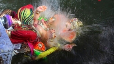 The Ganesh Nimajjan Yatra, or the immersion procession, that follows the laddu auction is a popular affair (AP) The Ganesh Nimajjan Yatra, or the immersion procession, that follows the laddu auction is a popular affair (AP)