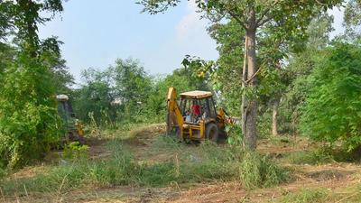 The vacant land opposite the Mini Secretariat, Ludhiana, being cleared for the establishment of a temporary parking site. (Gurpreet Singh/HT) The vacant land opposite the Mini Secretariat, Ludhiana, being cleared for the establishment of a temporary parking site. (Gurpreet Singh/HT)