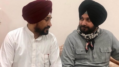 Charanjit Singh Channi (left) with Navjot Singh Sidhu at Channi's residence in July. (Photo: Twitter)
