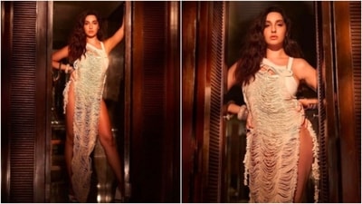 Nora Fatehi looked drop-dead gorgeous in this sultry nude thigh-high slit bodycon dress. (Instagram/@manekaharisinghani)