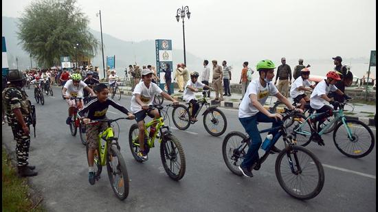 People participating in a cycle race organised by the J&K Police in Srinagar on Sunday. (ANI) People participating in a cycle race organised by the J&K Police in Srinagar on Sunday. (ANI)