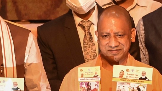 Uttar Pradesh CM Yogi Adityanath releases a book on completing 4.5 years of his government at Lok Bhawan in Lucknow (PTI Photo)