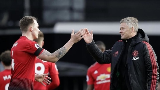 Manchester United caretaker head coach Ole Gunnar Solskjaer, right, and Manchester United's Phil Jones(AP) Manchester United caretaker head coach Ole Gunnar Solskjaer, right, and Manchester United's Phil Jones(AP)