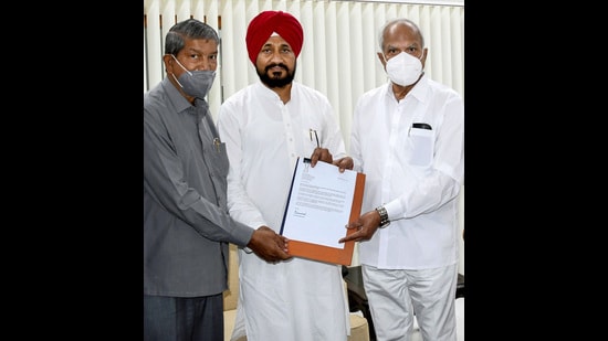 Punjab CM Designate Charanjit Singh Channi submits the letter to Punjab Governor Banwarilal Purohit after the former was announced as the next CM of Punjab, at Raj Bhavan in Chandigarh on Sunday. (PTI)