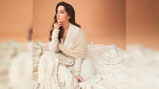 This look of ace dancer Nora Fatehi in an off-white Rohit Bal attire will surely leave you spellbound.(Instagram/@norafatehi)