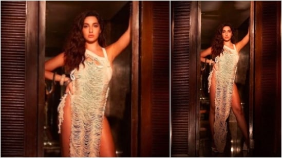 Nora Fatehi aced the thigh-high slit dress as she posed for the camera.(Instagram/@manekaharisinghani)