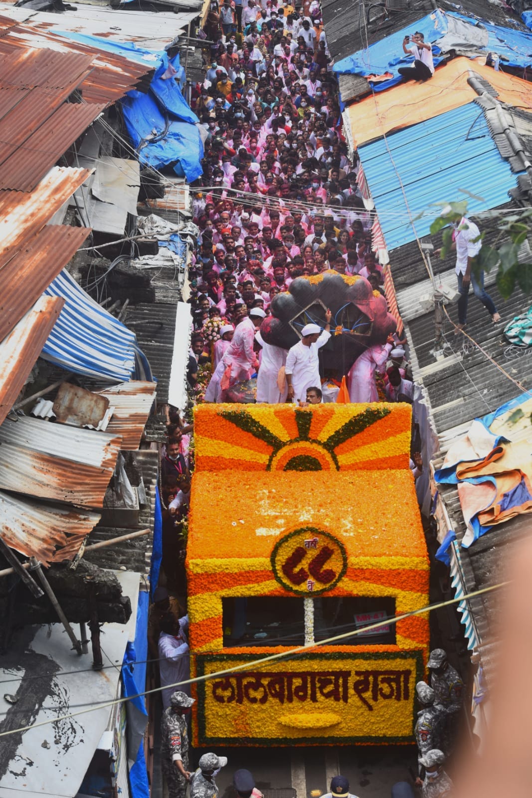 Devotees and volunteers at the immersion of the Ganesh idol of the famous Lalbaugcha Raja in Mumbai. (Satish Bate/HT Photo) Devotees and volunteers at the immersion of the Ganesh idol of the famous Lalbaugcha Raja in Mumbai. (Satish Bate/HT Photo)