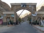 Taliban fighters stands guard at the entrance gate of Panjshir province. Taliban fighters stands guard at the entrance gate of Panjshir province.