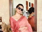 Kangana Ranaut clicked a few pictures before arriving for the hearing. Kangana Ranaut clicked a few pictures before arriving for the hearing.