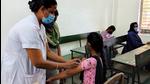 A healthcare worker inoculates a beneficiary with a dose of the Covid-19 vaccine in Madurai, Tamil Nadu. (File photo) A healthcare worker inoculates a beneficiary with a dose of the Covid-19 vaccine in Madurai, Tamil Nadu. (File photo)