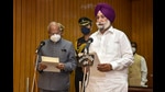 Punjab Governor Banwarilal Purohit administers the oath of office to Sukhjinder Singh Randhawa in Chandigarh on Monday. (PTI) Punjab Governor Banwarilal Purohit administers the oath of office to Sukhjinder Singh Randhawa in Chandigarh on Monday. (PTI)