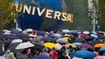 People wearing raincoats and carrying umbrellas walk through a plaza near the entrance of Universal Studios Beijing in Beijing, Monday, Sept. 20, 2021. Thousands of people brave the rain visit to the newest location of the global brand of theme parks which officially opens on Monday.(AP Photo/Andy Wong) People wearing raincoats and carrying umbrellas walk through a plaza near the entrance of Universal Studios Beijing in Beijing, Monday, Sept. 20, 2021. Thousands of people brave the rain visit to the newest location of the global brand of theme parks which officially opens on Monday.(AP Photo/Andy Wong)