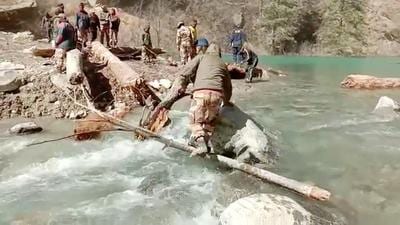A team of ITBP, SDRF, NDRF clears logs from the lake as the rescue operation continues in Chamoli earlier in February. (File photo)
