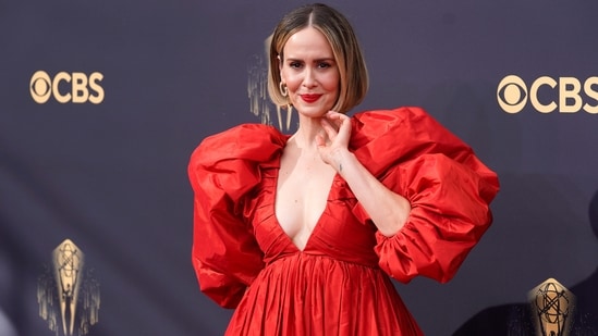 Sarah Paulson looked radiant as she arrived at the 73rd Primetime Emmy Awards in a bright red statement-making gown featuring plunging neckline, OTT sleeves and a voluminous skirt.&nbsp;(Chris Pizzello/Invision/AP)