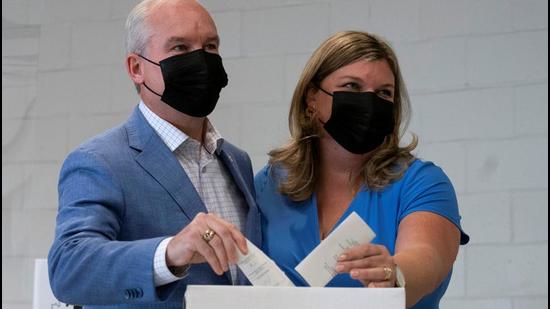 Canada’s opposition Conservative Party leader Erin O’Toole and his wife Rebecca cast their ballots for national elections, in Bowmanville, Ontario, on Monday. (REUTERS) Canada’s opposition Conservative Party leader Erin O’Toole and his wife Rebecca cast their ballots for national elections, in Bowmanville, Ontario, on Monday. (REUTERS)