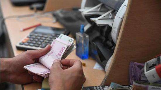 A 28-year-old businessman from Pune was duped by two men who offered to exchange Indian currency for UAE dirhams at a rate lower than the official exchange rate. (AFP/REPRESENTATIVE PHOTO) A 28-year-old businessman from Pune was duped by two men who offered to exchange Indian currency for UAE dirhams at a rate lower than the official exchange rate. (AFP/REPRESENTATIVE PHOTO)
