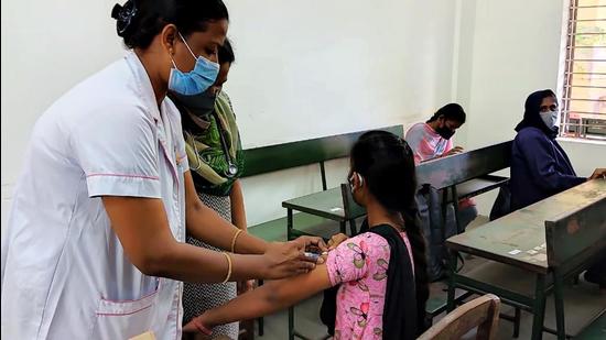 A healthcare worker inoculates a beneficiary with a dose of the Covid-19 vaccine in Madurai, Tamil Nadu. (File photo) A healthcare worker inoculates a beneficiary with a dose of the Covid-19 vaccine in Madurai, Tamil Nadu. (File photo)