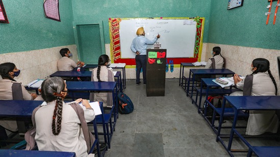 Students attend a class in a school that reopened after further ease in COVID-19 lockdown restrictions, in Jammu on Monday, Sept. 20. J-K administration has allowed schools to reopen for 10th and 12th classes(PTI)