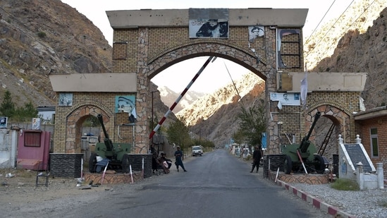 Taliban fighters stands guard at the entrance gate of Panjshir province.(AFP Photo)