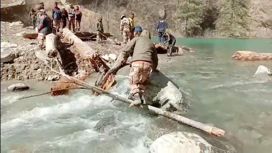 A team of ITBP, SDRF, NDRF clears logs from the lake as the rescue operation continues in Chamoli earlier in February. (File photo)