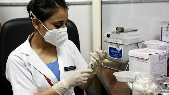 A healthcare worker fills a syringe with a dose of the Covid-19 vaccine at AIIMS vaccination centre in New Delhi on Monday. The exports will be facilitated under the government’s ‘Vaccine Maitri’ initiative. (Ayush Sharma)
