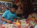 Durga Puja is celebrated for ten days in the Ashwin month. It is not just a festival for the people of Bengal but also an emotion. This year Navratri will commence on October 7, 2021, and will end on October 15, 2021. Due to the current Covid-19 situation, the celebration will be scaled down all over India. Here are a few pictures of how the people of Kolkata are gearing up for the biggest festival in the city.(PTI)