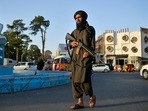 In this picture taken on September 19, 2021, a Taliban fighter (R) patrols along a street in Herat. In this picture taken on September 19, 2021, a Taliban fighter (R) patrols along a street in Herat. 
