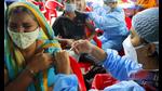 A medic administers the Covid-19 vaccine to a beneficiary during the vaccination drive in Lucknow. (ANI Photo) A medic administers the Covid-19 vaccine to a beneficiary during the vaccination drive in Lucknow. (ANI Photo)