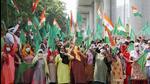 Women farmers hold the national flag during their protest ahead of UP chief minister Yogi Adityanath's visit outside Greater Noida authority, Tuesday. (PTI) Women farmers hold the national flag during their protest ahead of UP chief minister Yogi Adityanath's visit outside Greater Noida authority, Tuesday. (PTI)