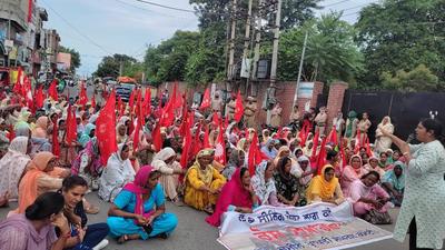 Dalit women holding a protest march to seek implementation of the Land Ceiling Act in Punjab, at Sangrur on Tuesday. (HT Photo)