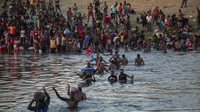 Migrants, many from Haiti, attempt to cross the Rio Grande from Del Rio, Texas, to return to Ciudad Acuña, Mexico, on September 19. Many Haitians began attempting to enter the US in the 1980s by sea. Most of them were cut off by the Coast Guard and perhaps given a cursory screening for asylum eligibility, David FitgGerald, a sociology professor at the University of California, San Diego told AP. (Felix Marquez / AP) Migrants, many from Haiti, attempt to cross the Rio Grande from Del Rio, Texas, to return to Ciudad Acuña, Mexico, on September 19. Many Haitians began attempting to enter the US in the 1980s by sea. Most of them were cut off by the Coast Guard and perhaps given a cursory screening for asylum eligibility, David FitgGerald, a sociology professor at the University of California, San Diego told AP. (Felix Marquez / AP)