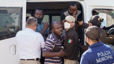 Haitian men struggle with Mexican immigration officials after being detained in Ciudad Acuna, Coahuila state, Mexico, on September 20. Tens of thousands of Haitians fled after a devastating earthquake in 2010 to settle in South America. After jobs dried up from the Summer Olympics in Rio de Janeiro in 2016, many came to Tijuana. President Barack Obama initially allowed them in the US on humanitarian grounds but abruptly began flying them back to Haiti, leaving many stranded on the Mexican border. (Paul Ratje / AFP) Haitian men struggle with Mexican immigration officials after being detained in Ciudad Acuna, Coahuila state, Mexico, on September 20. Tens of thousands of Haitians fled after a devastating earthquake in 2010 to settle in South America. After jobs dried up from the Summer Olympics in Rio de Janeiro in 2016, many came to Tijuana. President Barack Obama initially allowed them in the US on humanitarian grounds but abruptly began flying them back to Haiti, leaving many stranded on the Mexican border. (Paul Ratje / AFP)