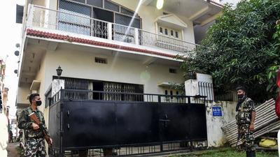 Security personnel outside the residence of constable Narendra Kumar Dhiraj during a raid conducted by EOU in Patna on Tuesday. (PTI) Security personnel outside the residence of constable Narendra Kumar Dhiraj during a raid conducted by EOU in Patna on Tuesday. (PTI)