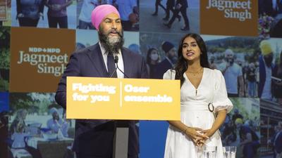Jagmeet Singh, leader of the New Democratic Party (NDP), speaks alongside his wife Gurkiran Kaur Sidhu during an NDP election night event in Vancouver, British Columbia, Canada, on September 20, 2021. Prime Minister Justin Trudeau won a third term in the Canada elections. (Bloomberg) Jagmeet Singh, leader of the New Democratic Party (NDP), speaks alongside his wife Gurkiran Kaur Sidhu during an NDP election night event in Vancouver, British Columbia, Canada, on September 20, 2021. Prime Minister Justin Trudeau won a third term in the Canada elections. (Bloomberg)