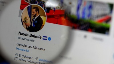 The twitter profile of El Salvador's President Nayib Bukele reading 'Dictator of El Salvador' is seen on a computer screen in this photo illustration. (Reuters)