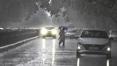 Commuters in the rain at Janpath on Tuesday. Delhi received 3.6mm rain on Tuesday, IMD said, and added that rain will continue through the week. Delhi this year has been witnessing an erratic monsoon (Raj K Raj/ HT Photo)