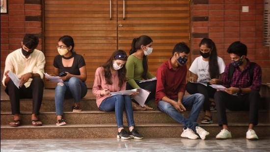 Students at Delhi University campus after DDMA allowed DU to reopen on September 15. The university has formed a National Education Policy (NEP) committee to frame syllabi for six new interdisciplinary courses. (Sanchit Khanna/HT Photo)