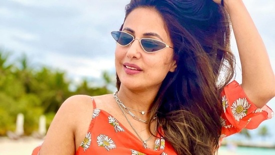 She accessorised her look with a pair of blue cat-eye framed sunglasses and a layered necklace.(Instagram/realhinakhan)