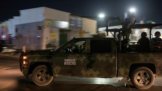 Mexican army soldiers patrol the street in Ciudad Acuña, on September 20. Over the years Haitians have found work at border factories built for US exports and at car washes. One hardscrabble neighbourhood is now known as “Little Haiti" because so many settled there.(Felix Marquez / AP)