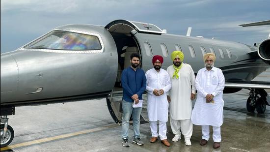 Punjab chief minister Charanjit Singh Channi with PPCC chief Navjot Singh Sidhu and deputy CM Sukhjinder S Randhawa before the departure of their flight, in Chandigarh on Tuesday. (ANI)